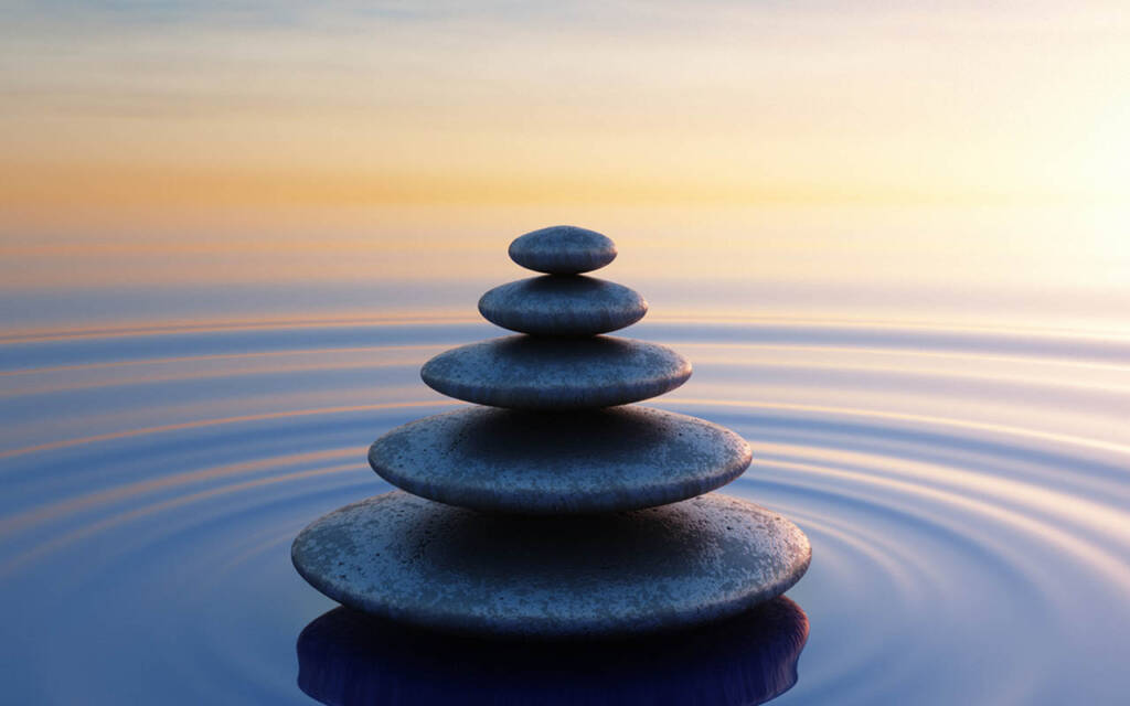 Stack of stones in calm ocean