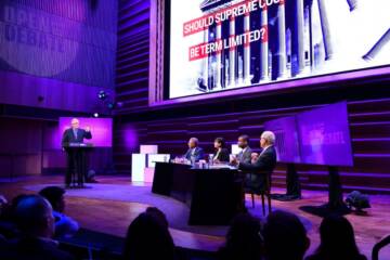 panel of speakers at an Open to Debate event